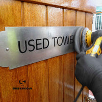 surfsaviour chemical-free stainless steel cleaning of a panel with the 150mm cleaning disc fitted to a sander machine